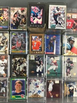 Group of 30+ plastic card cases containing NFL trading cards