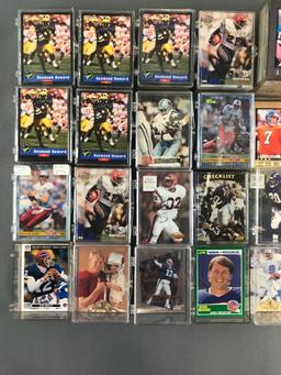 Group of 30+ plastic card cases containing NFL trading cards