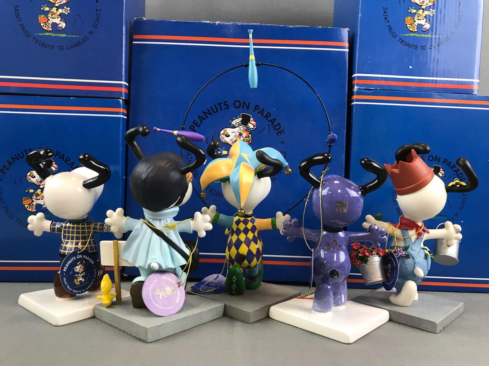 Group of 5 Westland Giftware Peanuts on Parade Snoopy figurines in original packaging