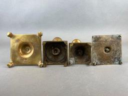 Group of 4 Assorted Brass Pedestal Candlesticks