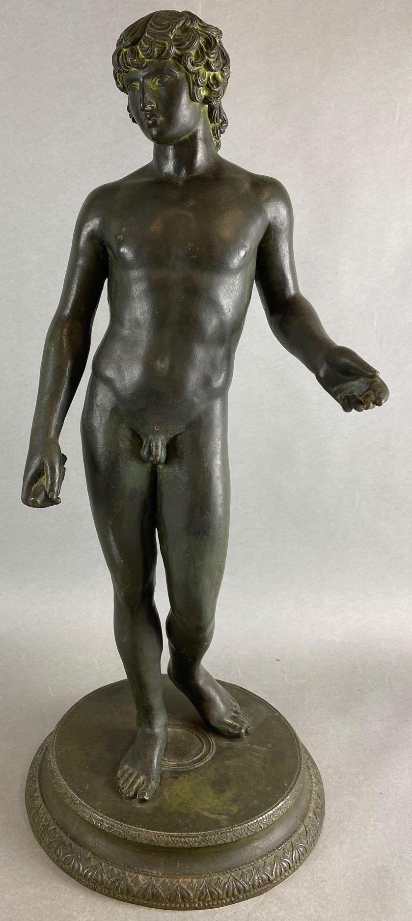 Classical Statue of a Man Holding a Baton