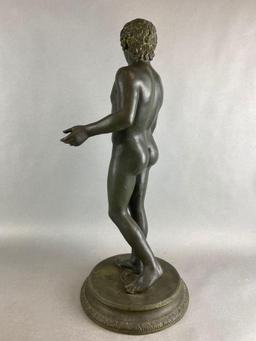 Classical Statue of a Man Holding a Baton