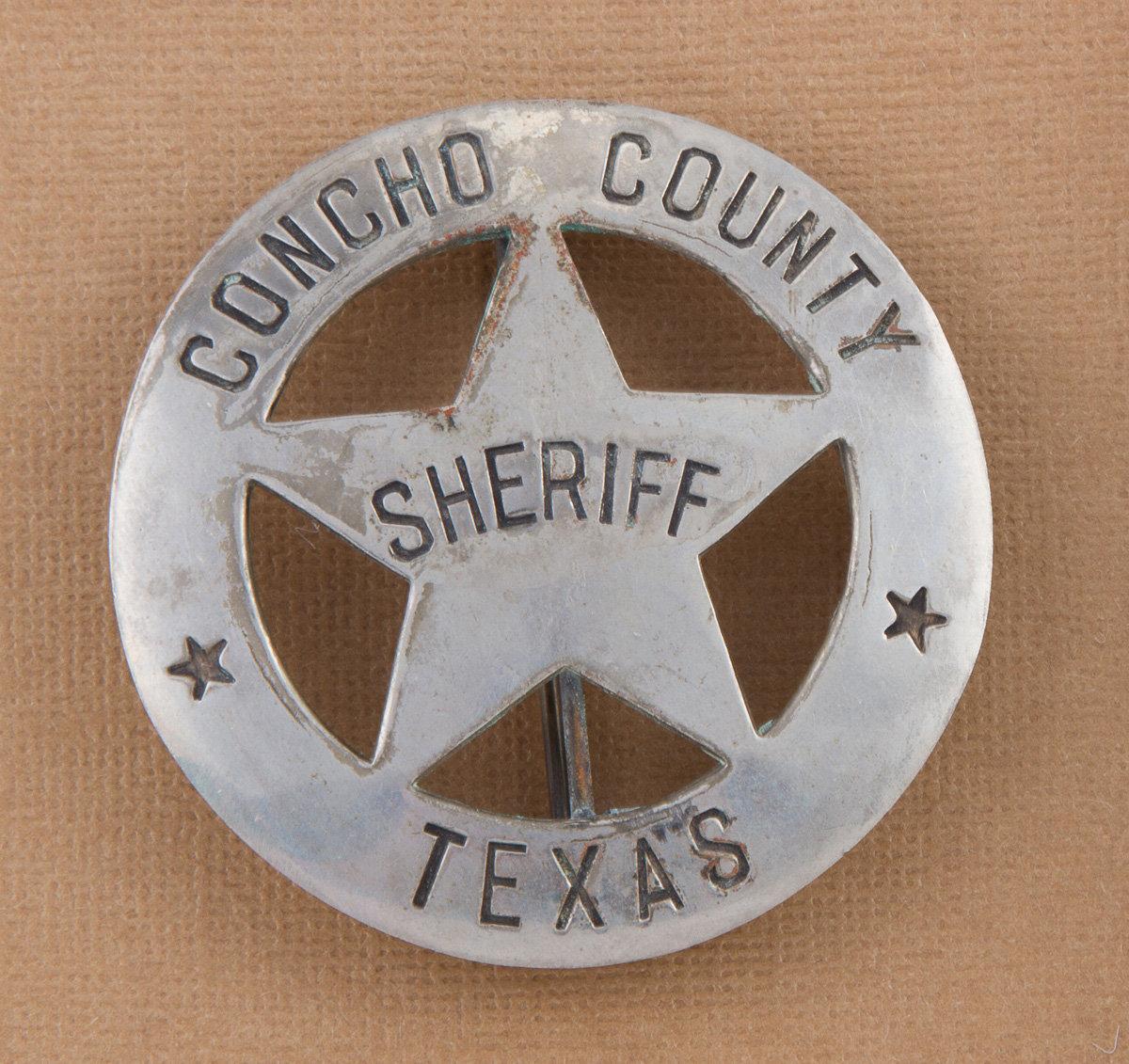 Circle star Badge, "SHERIFF, CONCHO COUNTY, TEXAS",  2 3/4" across, showing nice even wear.  George