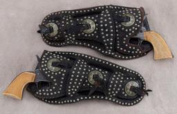 Scarce, matching pair of early "R.T. Frazier" marked, spotted double loop Holsters with matching con