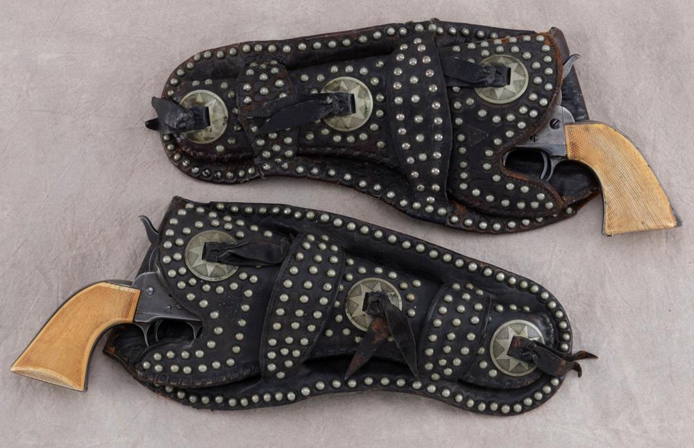 Scarce, matching pair of early "R.T. Frazier" marked, spotted double loop Holsters with matching con