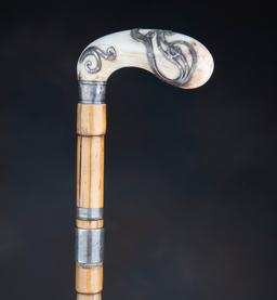 Vintage Walking Cane with bamboo style shaft, 35" long, with silver spacers and silver mounted ivory