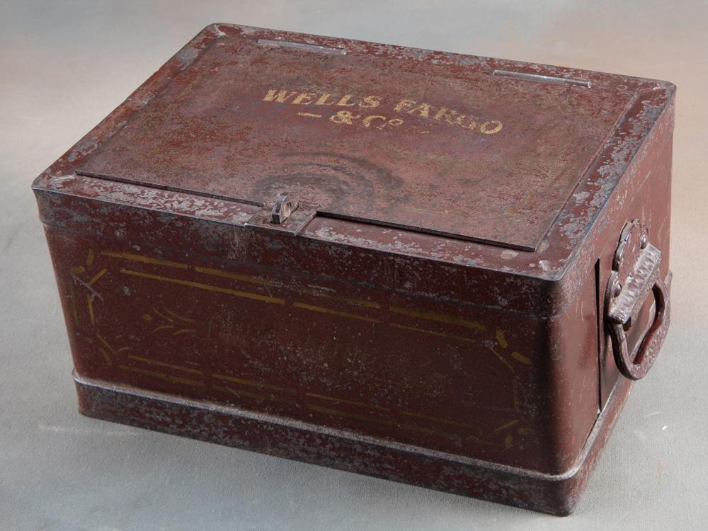 Heavy iron "WELLS FARGO & COMPANY" marked Strong Box with embossed double handles, 6 1/2" tall x 13"