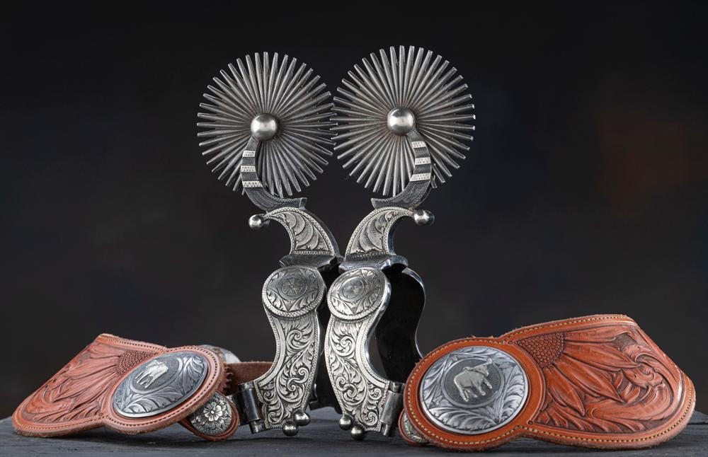 Very showy pair of double mounted, hand engraved, silver overlay Spurs by noted West Bountiful, Utah