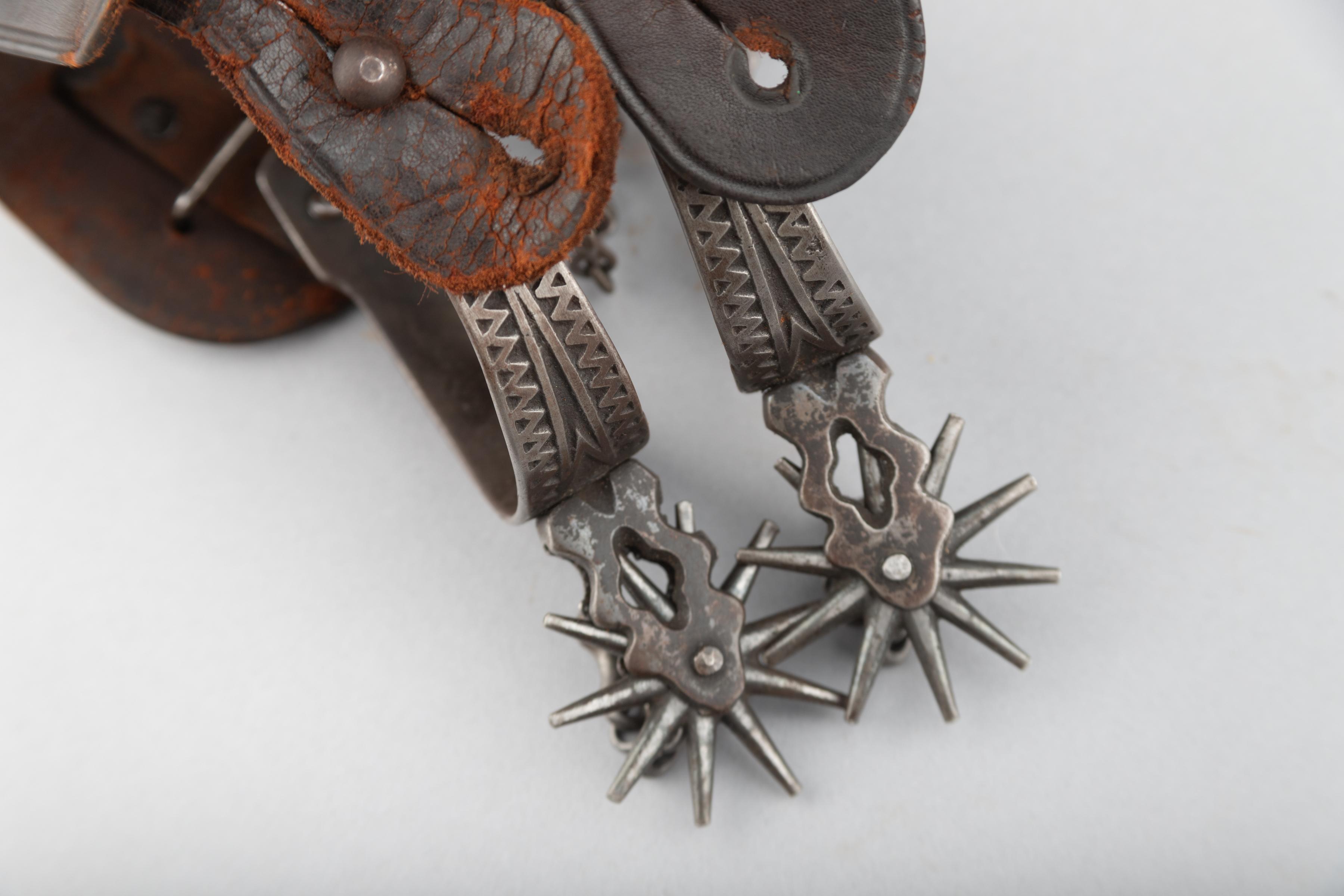 Vintage pair of August Buermann Spurs in the famous Ranger pattern, complete with heel chains and or