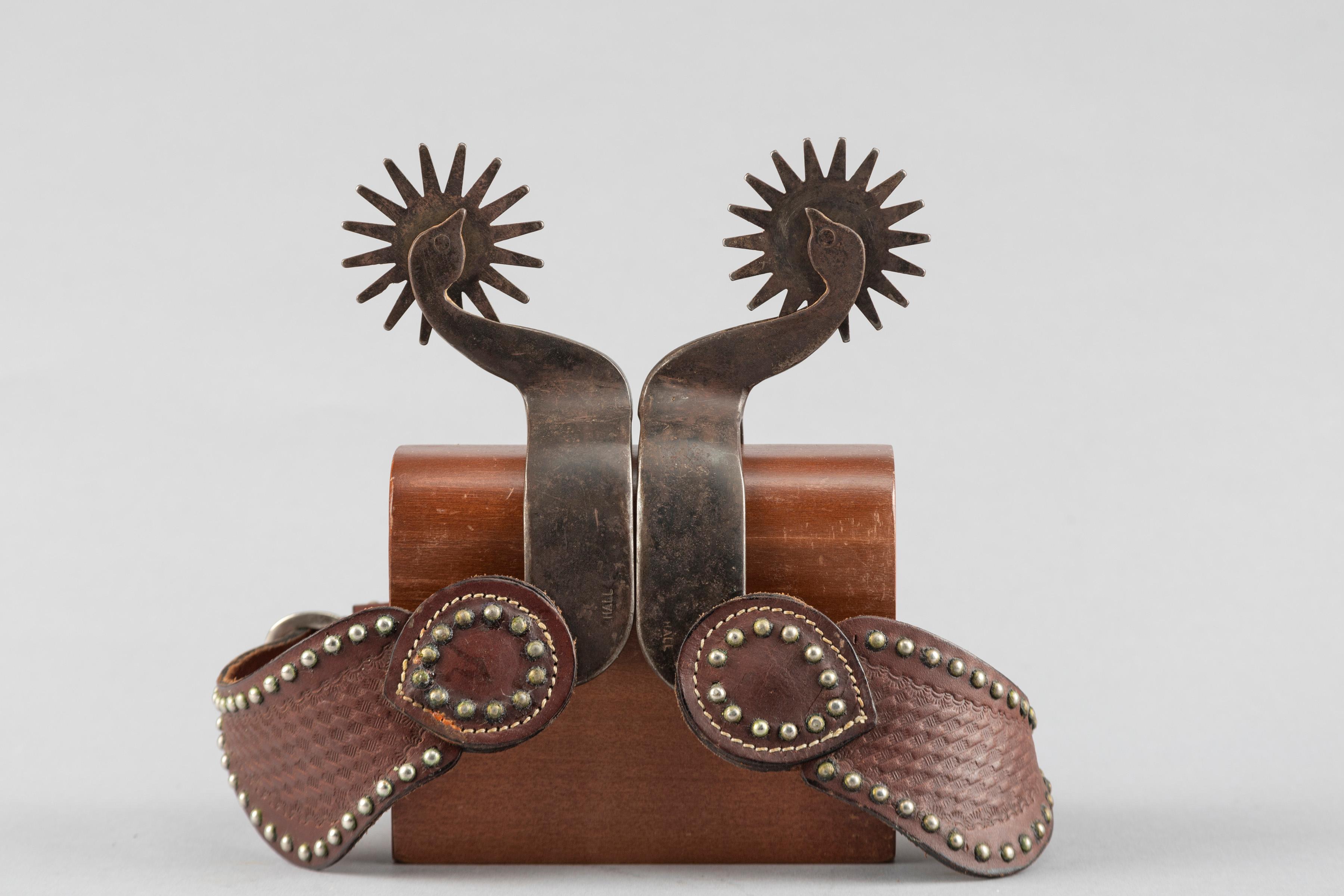 Pair of "Carl Hall" marked single mounted goose head Spurs with engraved diamond on heel bands and e