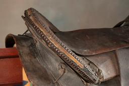 Fine early period leather Saddle, Indian used with unique horn and loop seat. Horn and seat are deco