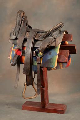 Fine early period leather Saddle, Indian used with unique horn and loop seat. Horn and seat are deco