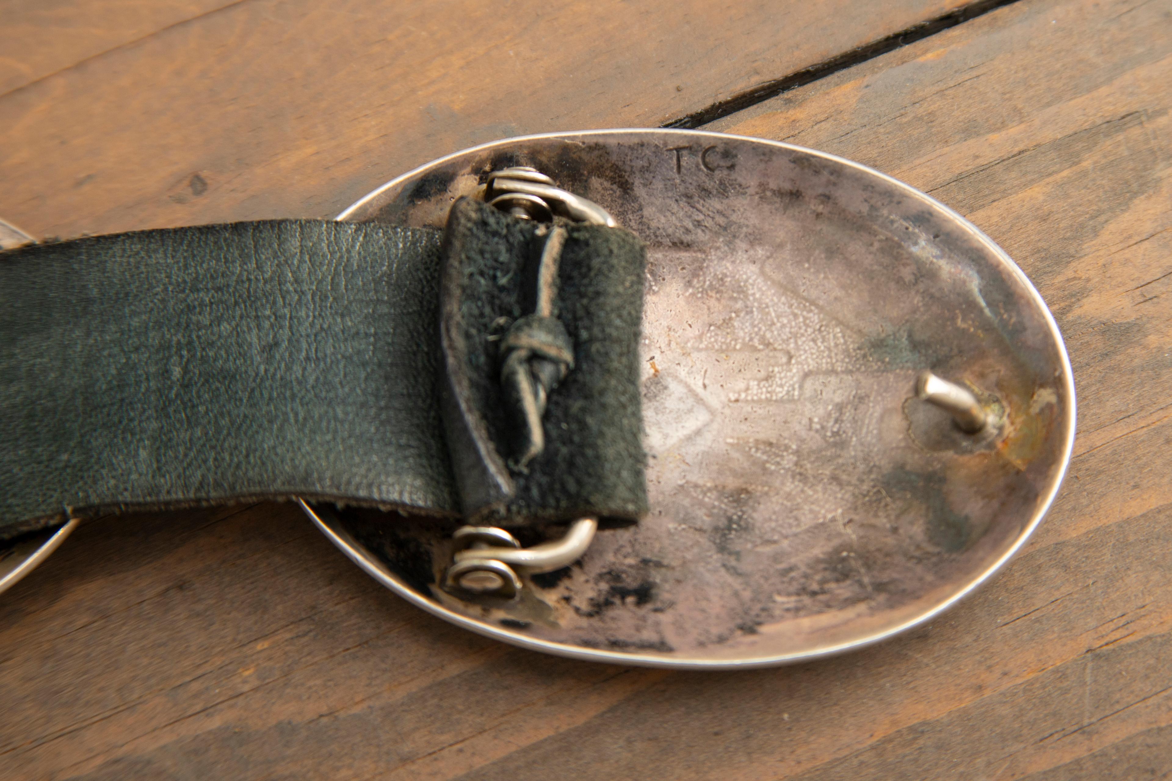 Beautiful silver Concho Belt with seven 3" domed conchos with inlaid coral and turquoise. Buckle is