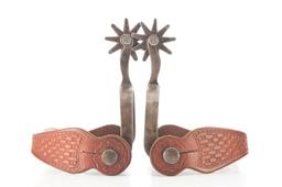 Pair of "Crockett" marked, single mounted Spurs with diamond shaped silver mountings on heel bands.