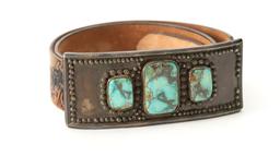 Turquoise and silver oblong Buckle, 6" L x 4 1/4" T, accompanied by a western tooled Belt with wagon