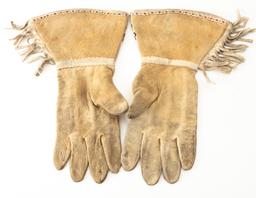 Pair of Doe Skin beaded Wild West Gauntlets with fringed border, circa 1910-1920. Showing use but in