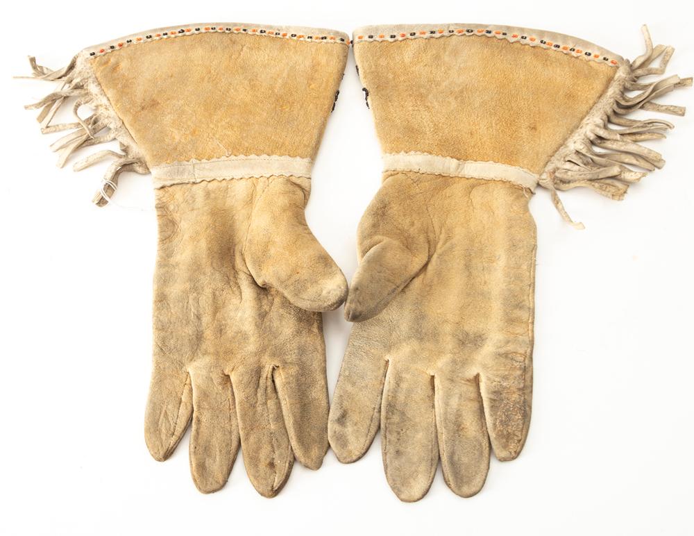Pair of Doe Skin beaded Wild West Gauntlets with fringed border, circa 1910-1920. Showing use but in