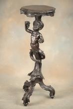 Antique figural carved mahogany Pedestal with full carved cherub supporting top. Very unique 13" dia