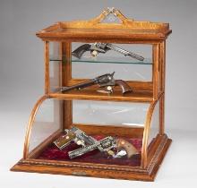 Very unique oak, curved glass, table top model Showcase with bronze label on front marked "J.W. Winc