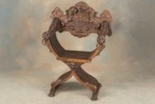 One of a near matching pair of heavily carved antique Fire Side Chairs, circa 1880s-90s, with massiv