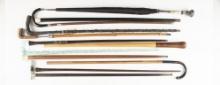 Collection of 12 Walking Sticks, Canes and one Umbrella in various shapes and sizes. One of these is