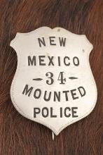Vintage â€œNEW MEXICO 34 MOUNTED POLICEâ€� marked Shield Badge with ticking around the edge, has ton