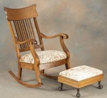 One of a matched pair of antique oak, arrow back Arm Rockers with matching glass ball and brass claw
