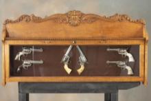 Unusual antique oak, glass front Revolver Display Case, circa 1900. The case is set up to hold six (