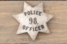 Large vintage 7-point Star Badge marked â€œPOLICE 98 OFFICERâ€�, possibly sterling silver with black