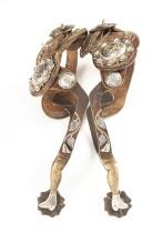 Unique pair of single mounted gal-leg Spurs with engraved leaves and vines on heel bands. Spurs are