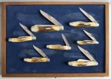 Set of seven (7) Double X Case Collectors Folding Blade Pocket Knives with polished stag handles. Th