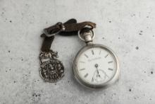 Antique open face silver man's Pocket Watch, manufactured by Elgin National Watch Co., in running co