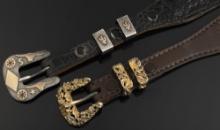 Two Western Ranger Dress Belts. (1) A black alligator, with sterling marked buckle and keepers with