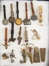 Framed Collection of 17 Items to include 10 Advertising Watch Fobs, 3 Watch Chains with fobs, 2 Pist