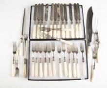 Group of fancy mismatched Silverware totaling 33 pieces with mother of pearl handles. The Late C.W.