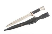 WWII German Army Dress Bayonet in overall fine condition made and marked by WKC. Scabbard shows some