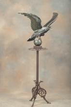 Large Eagle on metal Pedestal with footed base, 30" wing spread x 58" T. This pedestal was in Maries