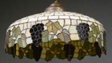 Antique leaded and stained glass hanging Dome Light Fixture, measures 24" Dia. x 12" D, in leaf and