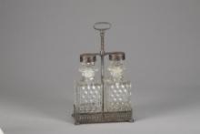 A vintage, fine quality silver and glass Tantalus (portable Bar) marked on base "Apollo Serial Numbe