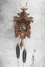 German two-weight Cuckoo Clock with stag head crest. Clock measures 16" T with removable crest. Comp