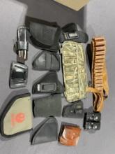Assorted holsters, books & misc.