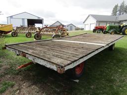 146. 4 WHEEL WAGON WITH OLDER 8 FT. X 16 FT. WOODEN FLAT RACK