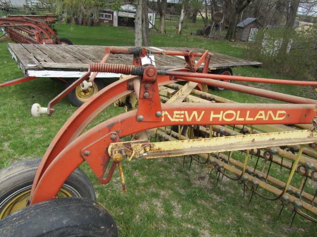 147. NEW HOLLAND 256 9 FT. PARALLEL BAR RAKE WITH HITCH WHEEL