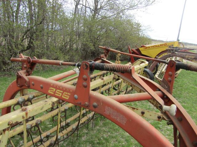 147. NEW HOLLAND 256 9 FT. PARALLEL BAR RAKE WITH HITCH WHEEL