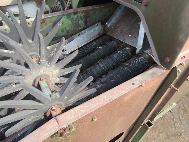 914. 327-823. NEW IDEA 325, TWO ROW 30 INCH CORN PICKER, TAX / SIGN ST3