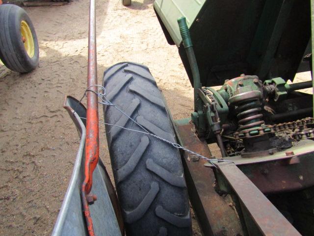 914. 327-823. NEW IDEA 325, TWO ROW 30 INCH CORN PICKER, TAX / SIGN ST3