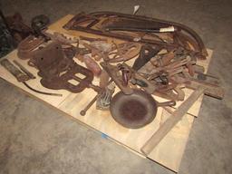 1648. PALLET OF BOW SAWS, HORSE SHOES, PLANES, WELL WHEEL, CAST IRON PAN AN