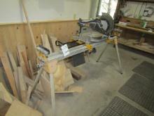1519. DEWALT # 715 12 INCH WOOD MITER SAW ON STAND