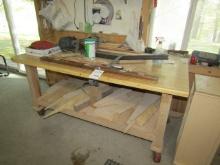 1522. WOODEN 36” X 71” WORK BENCH ON WHEELS