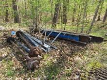 1561. PILE OF I BEAMS UP TO 19’ LONG AND 12” HIGH, TRAILER AXLES,